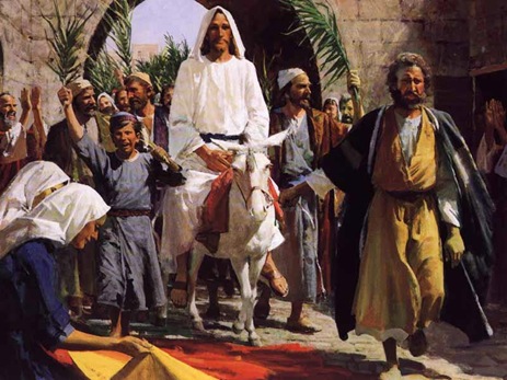Jesus rides into Jerusalem on a donkey